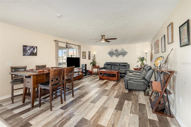 16012 Lanesboro Ct, Clermont, FL 34711 - dining area featuring a textured ceiling, wood finished floors, a ceiling fan, and baseboards