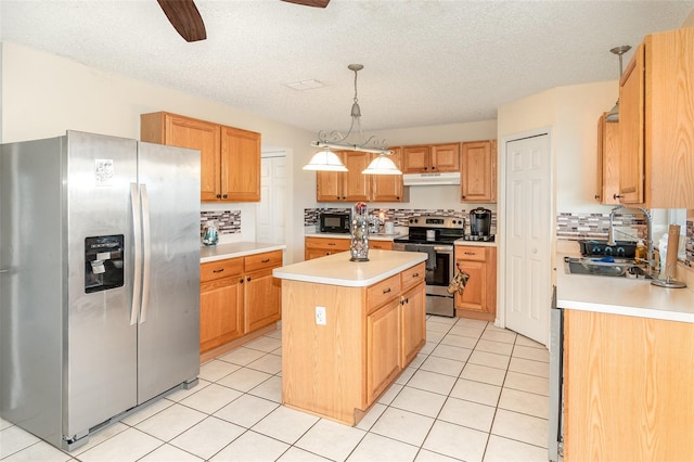 16012 Lanesboro Ct, Clermont, FL 34711 - kitchen with appliances with stainless steel finishes, under cabinet range hood, a ceiling fan, light countertops, and a center island