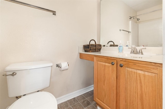 16012 Lanesboro Ct, Clermont, FL 34711 - bathroom with toilet, baseboards, and vanity