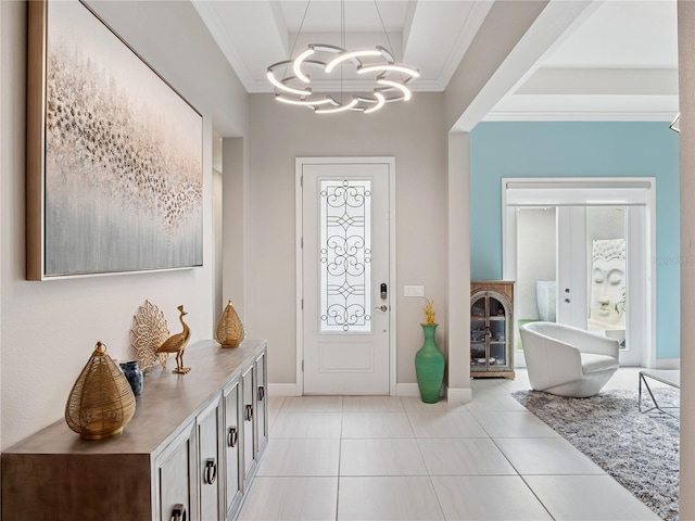 1265 Estancia Woods Loop, Windermere, FL 34786 - entryway featuring ornamental molding, a chandelier, light tile patterned floors, plenty of natural light, and a raised ceiling