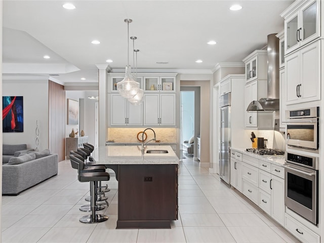 1265 Estancia Woods Loop, Windermere, FL 34786 - kitchen with appliances with stainless steel finishes, recessed lighting, backsplash, open floor plan, and wall chimney exhaust hood