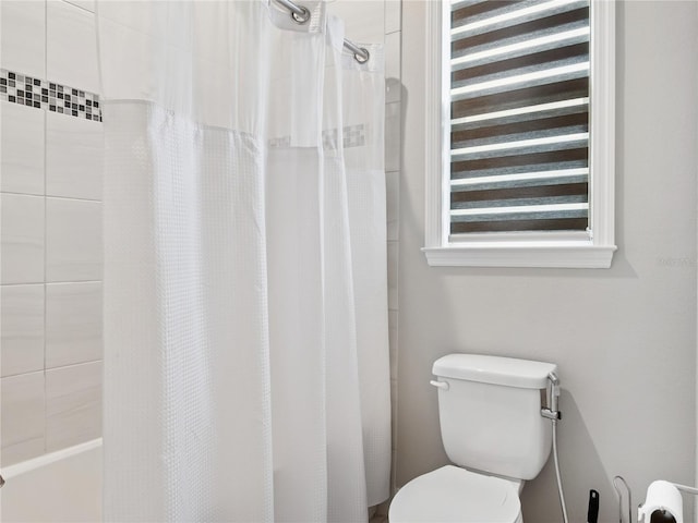 1265 Estancia Woods Loop, Windermere, FL 34786 - bathroom featuring toilet and shower / bathtub combination with curtain