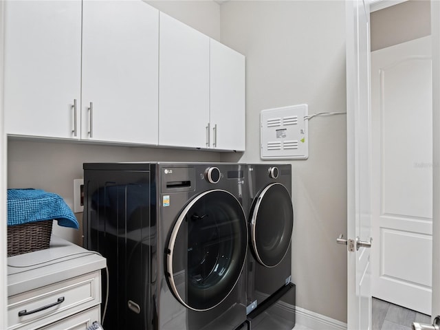 1265 Estancia Woods Loop, Windermere, FL 34786 - laundry area featuring washing machine and dryer and cabinet space