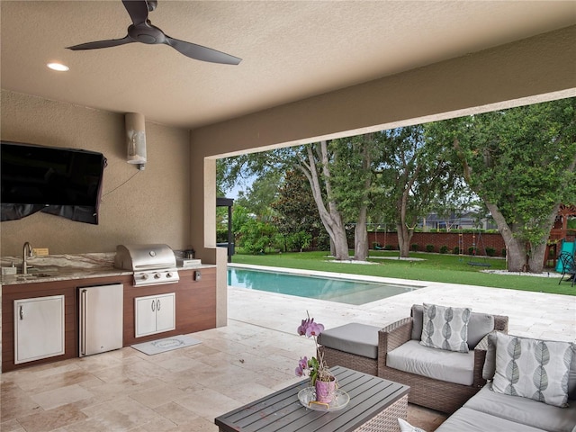 1265 Estancia Woods Loop, Windermere, FL 34786 - view of patio featuring an outdoor kitchen, a ceiling fan, and an outdoor hangout area