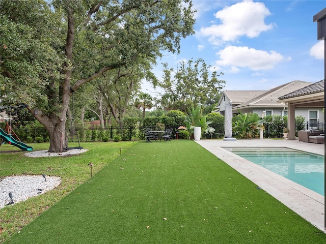 1265 Estancia Woods Loop, Windermere, FL 34786 - view of yard with a playground and a patio