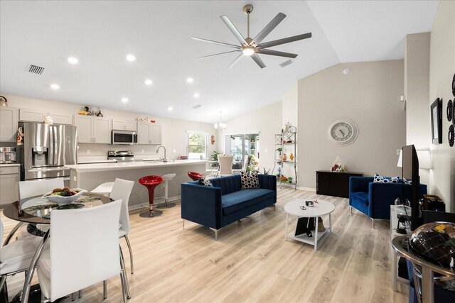 9020 SE 42nd Ct, Ocala, FL 34480 - living area featuring lofted ceiling, ceiling fan, light wood-type flooring, and recessed lighting