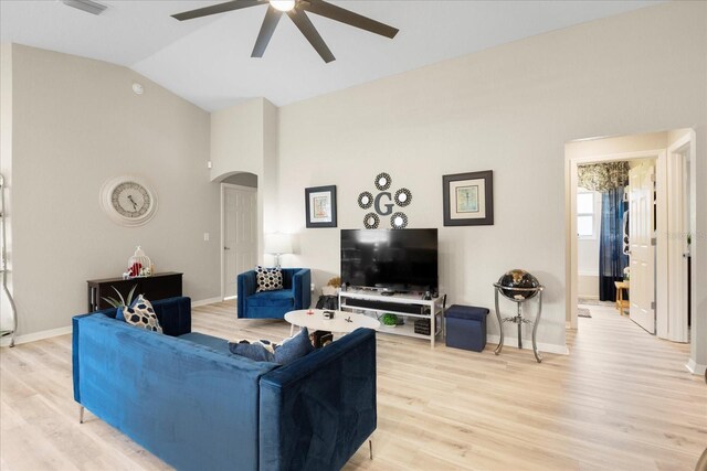 9020 SE 42nd Ct, Ocala, FL 34480 - living room featuring arched walkways, a ceiling fan, light wood-style flooring, and high vaulted ceiling