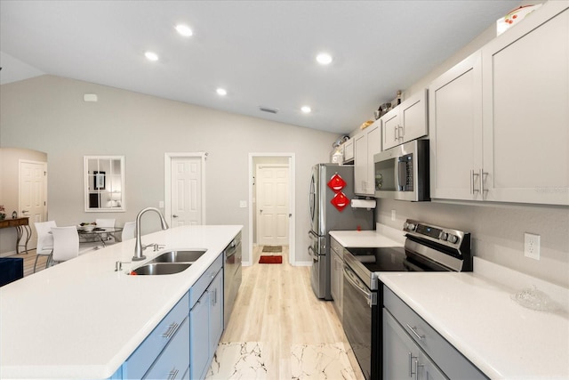 9020 SE 42nd Ct, Ocala, FL 34480 - kitchen with appliances with stainless steel finishes, vaulted ceiling, light countertops, a kitchen island with sink, and recessed lighting
