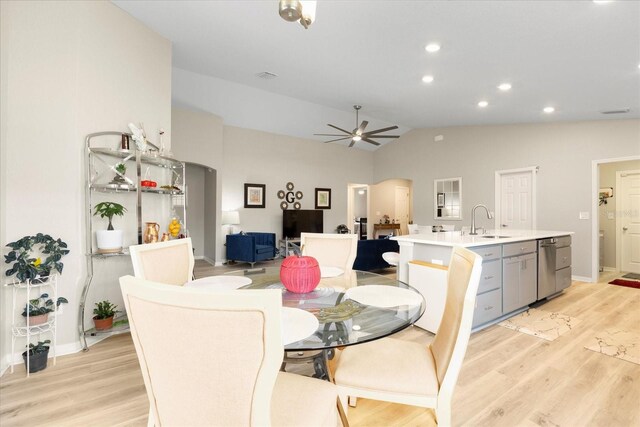 9020 SE 42nd Ct, Ocala, FL 34480 - dining space featuring light wood-style floors, a ceiling fan, vaulted ceiling, recessed lighting, and arched walkways