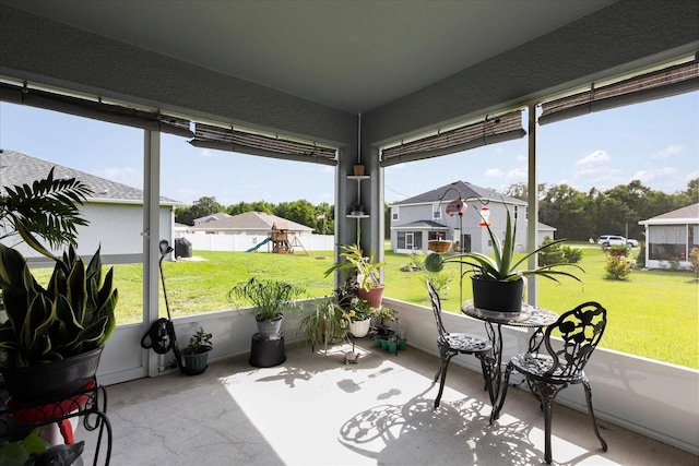 9020 SE 42nd Ct, Ocala, FL 34480 - sunroom / solarium with healthy amount of natural light, a residential view, and carpet