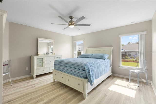 9020 SE 42nd Ct, Ocala, FL 34480 - bedroom with light wood-style flooring and ceiling fan