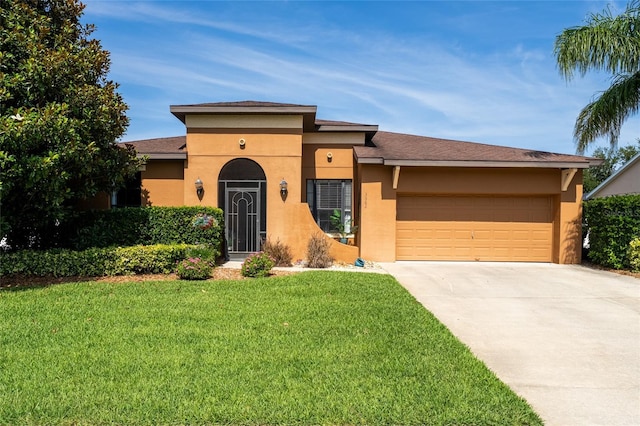 3562 Foxchase Dr, Clermont, FL 34711 - view of front of property featuring stucco siding, a garage, driveway, and a front yard
