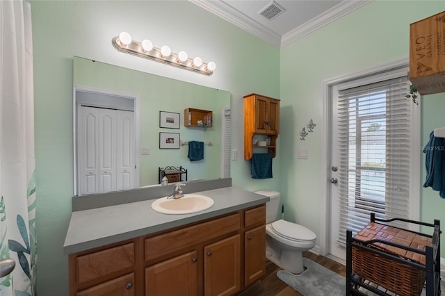 3562 Foxchase Dr, Clermont, FL 34711 - bathroom featuring vanity, crown molding, and wood finished floors