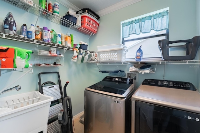 3562 Foxchase Dr, Clermont, FL 34711 - laundry area with washing machine and dryer and crown molding