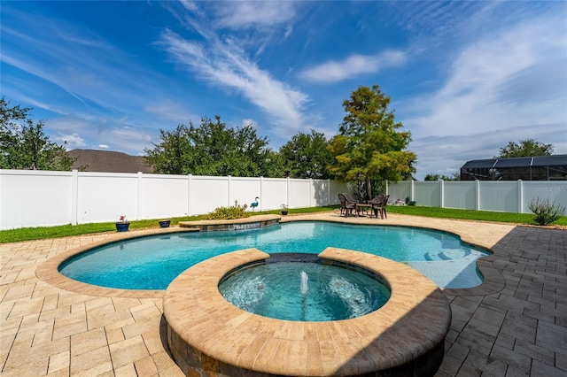 3562 Foxchase Dr, Clermont, FL 34711 - view of pool featuring a patio, a fenced backyard, and a pool with connected hot tub