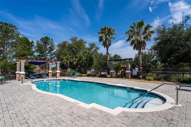 3562 Foxchase Dr, Clermont, FL 34711 - community pool with a pergola and a patio area