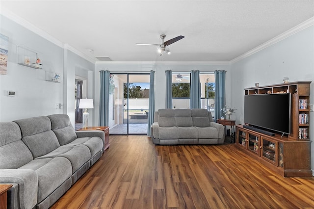 3562 Foxchase Dr, Clermont, FL 34711 - living room featuring wood finished floors, ceiling fan, and crown molding