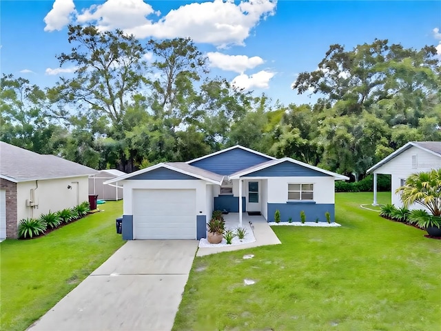 324 James Pl, Saint Cloud, FL 34769 - ranch-style house featuring a garage, a front yard, concrete driveway, and stucco siding