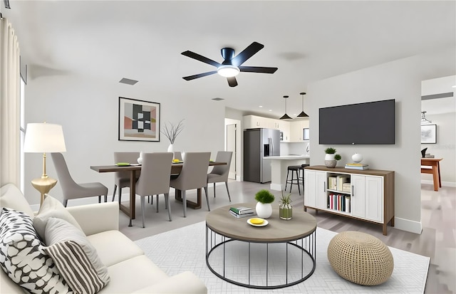 324 James Pl, Saint Cloud, FL 34769 - living area with ceiling fan, light wood-style flooring, and baseboards