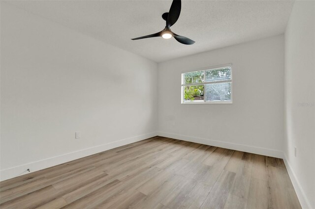 324 James Pl, Saint Cloud, FL 34769 - empty room featuring light wood-type flooring, ceiling fan, and baseboards
