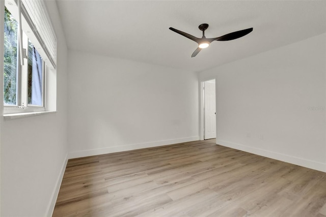 324 James Pl, Saint Cloud, FL 34769 - spare room with light wood-type flooring, ceiling fan, and baseboards