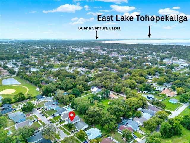 324 James Pl, Saint Cloud, FL 34769 - aerial view of property and surrounding area featuring a large body of water and nearby suburban area