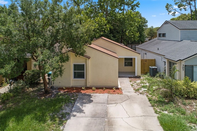 309 Kirkcaldy Dr, Winter Springs, FL 32708 - view of front of property featuring cooling unit, a patio area, and stucco siding