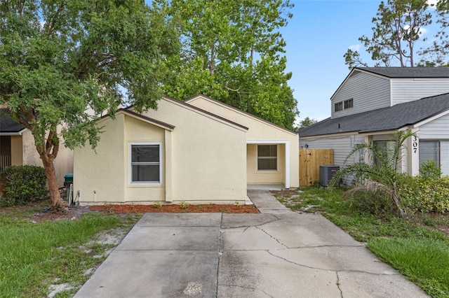 309 Kirkcaldy Dr, Winter Springs, FL 32708 - view of front of home featuring a patio area, stucco siding, and central AC unit
