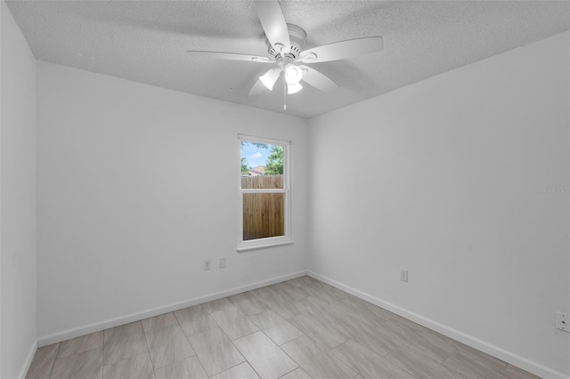 309 Kirkcaldy Dr, Winter Springs, FL 32708 - spare room featuring a textured ceiling, ceiling fan, and baseboards