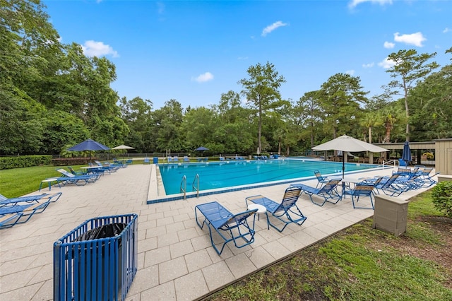 309 Kirkcaldy Dr, Winter Springs, FL 32708 - community pool featuring a patio and view of wooded area
