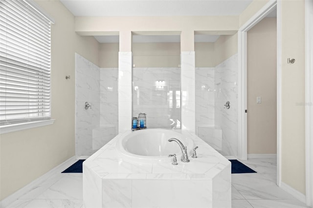 7163 Talamore Dr, Wesley Chapel, FL 33545 - bathroom featuring a garden tub, marble finish flooring, baseboards, and a marble finish shower