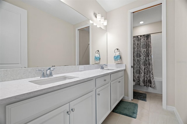7163 Talamore Dr, Wesley Chapel, FL 33545 - bathroom featuring double vanity, tile patterned flooring, shower / tub combo with curtain, baseboards, and recessed lighting