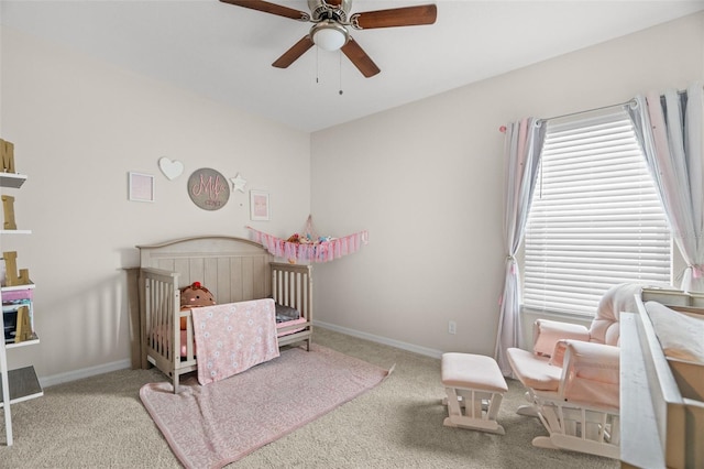 7163 Talamore Dr, Wesley Chapel, FL 33545 - bedroom featuring carpet, a nursery area, baseboards, and ceiling fan