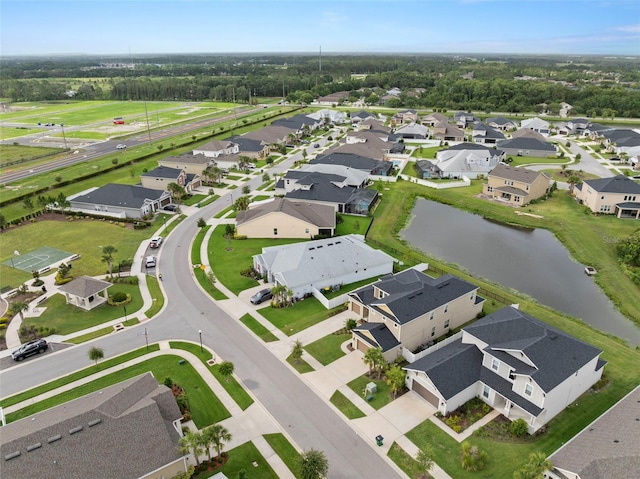 7163 Talamore Dr, Wesley Chapel, FL 33545 - aerial overview of property's location with a nearby body of water and nearby suburban area