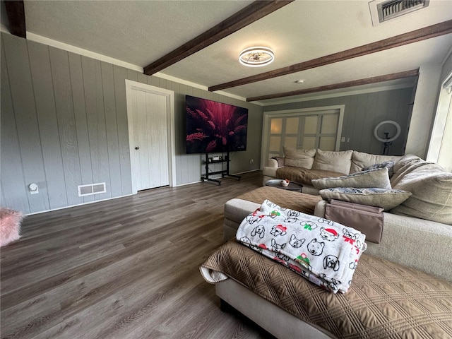 3702 Mirror Lake Dr, Apopka, FL 32703 - living room with beamed ceiling, wood finished floors, wooden walls, and a textured ceiling