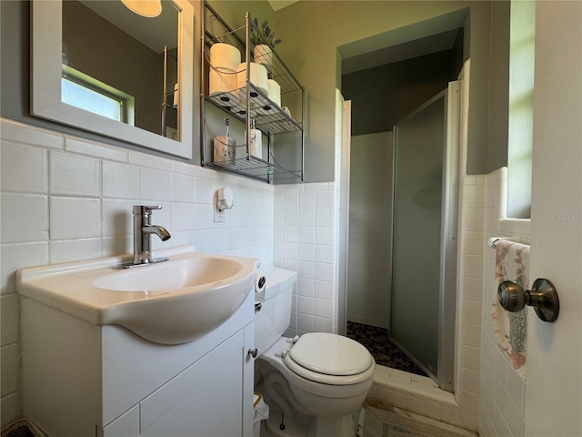 3702 Mirror Lake Dr, Apopka, FL 32703 - bathroom featuring tile walls, a stall shower, toilet, vanity, and wainscoting