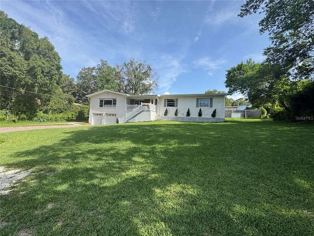3702 Mirror Lake Dr, Apopka, FL 32703 - ranch-style home with an attached garage, a front lawn, and stairs
