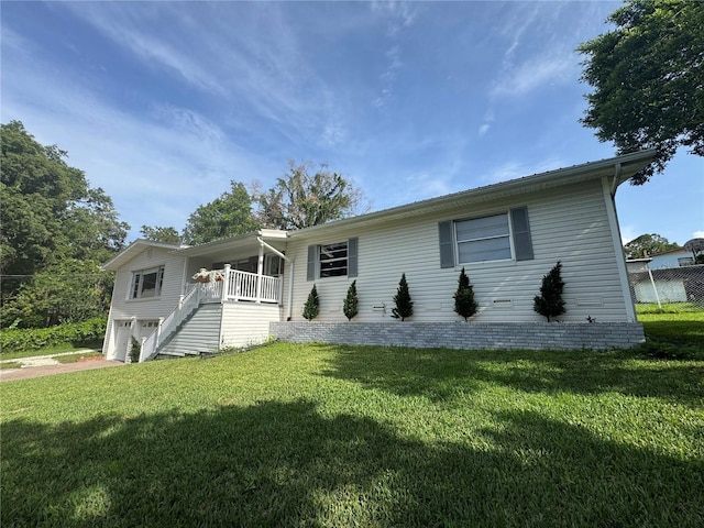 3702 Mirror Lake Dr, Apopka, FL 32703 - ranch-style home with a garage, a front yard, and stairway
