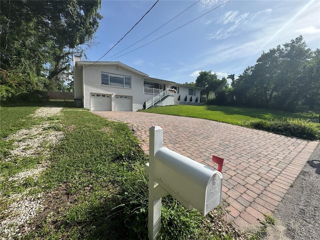 3702 Mirror Lake Dr, Apopka, FL 32703 - view of front of property featuring decorative driveway, an attached garage, and a chimney