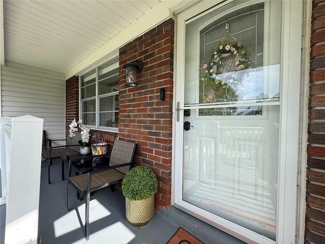 3702 Mirror Lake Dr, Apopka, FL 32703 - doorway to property with a porch and brick siding