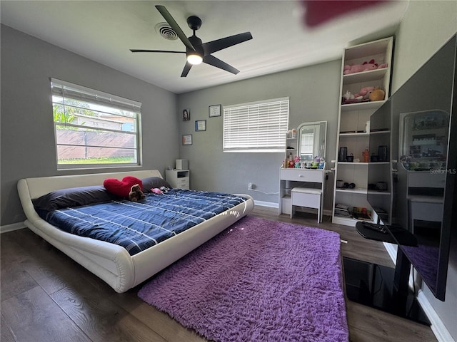 3702 Mirror Lake Dr, Apopka, FL 32703 - bedroom with wood finished floors, baseboards, and ceiling fan