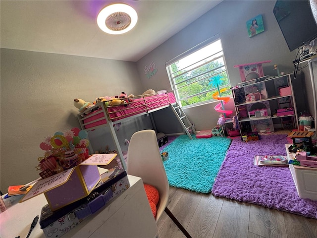 3702 Mirror Lake Dr, Apopka, FL 32703 - bedroom featuring wood finished floors and a textured wall