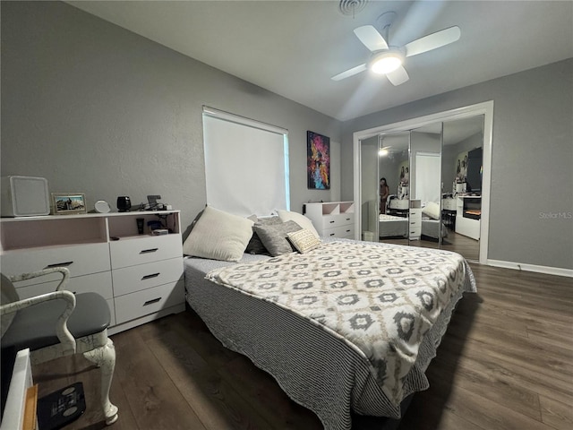 3702 Mirror Lake Dr, Apopka, FL 32703 - bedroom featuring dark wood finished floors, a closet, a ceiling fan, and baseboards