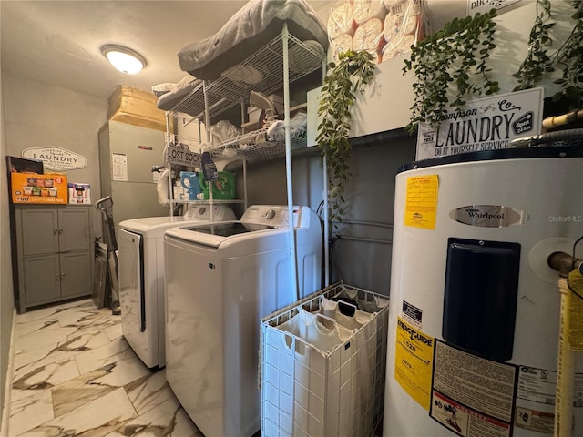 3702 Mirror Lake Dr, Apopka, FL 32703 - laundry room with electric water heater, washer and dryer, and light marble finish floors