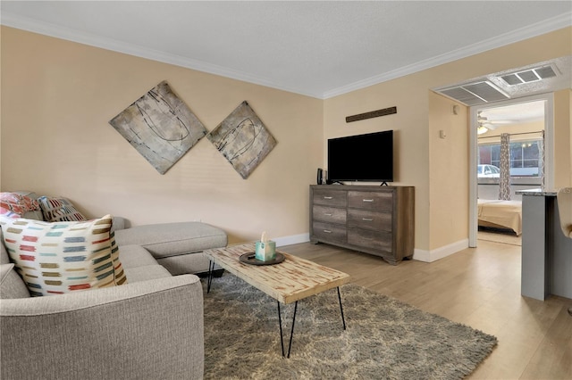 145 Oyster Bay Cir Unit 140, Altamonte Springs, FL 32701 - living area with light wood finished floors, crown molding, baseboards, and ceiling fan