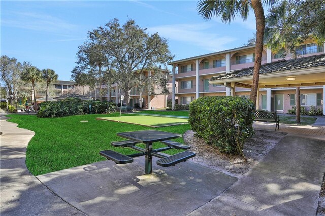 145 Oyster Bay Cir Unit 140, Altamonte Springs, FL 32701 - view of home's community featuring a lawn and a putting area