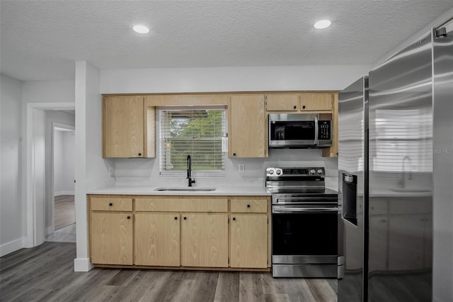 418 Tulane Dr, Altamonte Springs, FL 32714 - kitchen featuring appliances with stainless steel finishes, a sink, a textured ceiling, light countertops, and dark wood finished floors