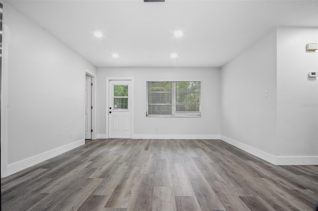 418 Tulane Dr, Altamonte Springs, FL 32714 - unfurnished living room with wood finished floors, recessed lighting, and baseboards