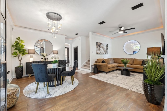 602 E Livingston St Unit 3, Orlando, FL 32803 - living room featuring a chandelier, stairs, ornamental molding, and ceiling fan