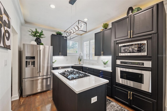 602 E Livingston St Unit 3, Orlando, FL 32803 - kitchen featuring stainless steel appliances, light countertops, a center island, recessed lighting, and a chandelier